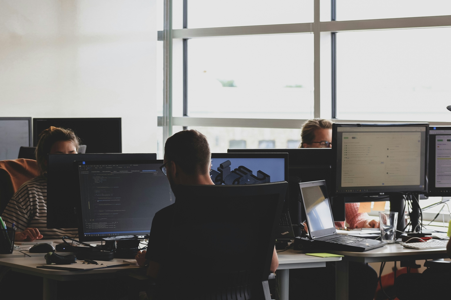 people-working-in-an-open-space-on-their-computers